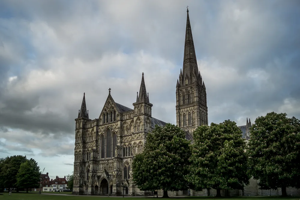 The west front and spire of Salisbury Cathedral, seen across the lawn